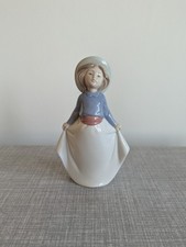"Girl Picking up her Skirt" porcelain figurine by Nao, 01290, with box