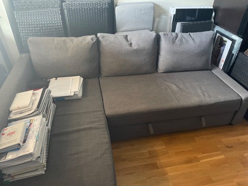 Grey corner sofa bed with