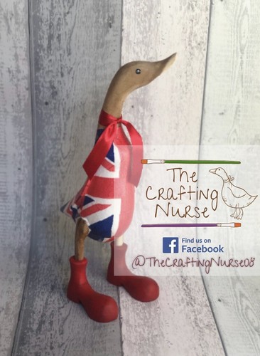 Wooden duck with - with, wellies
