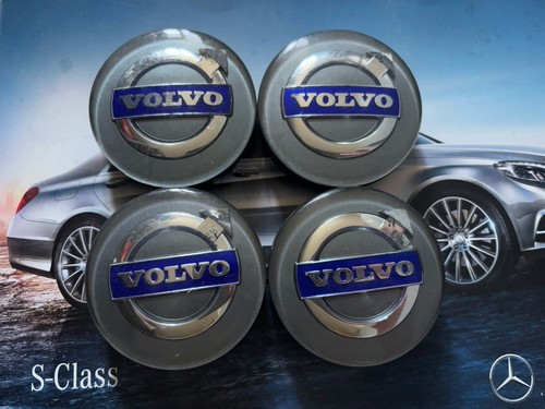 Four genuine volvo wheel caps - four,