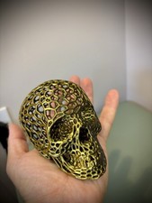 Skull Ornament. Gold/Black silk color. Hollow textured spooky ornament!