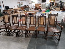 A Set of 6 Oak and Rattan Dinning Chairs with Wooden Legs And 2 Are Carvers