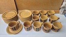 70s coffee cup and plate set. Golden brown with geometric design.Made in England