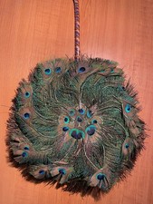 A Peacock feather circular fan
