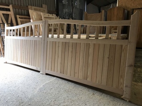 Wooden driveway gates near - driveway,