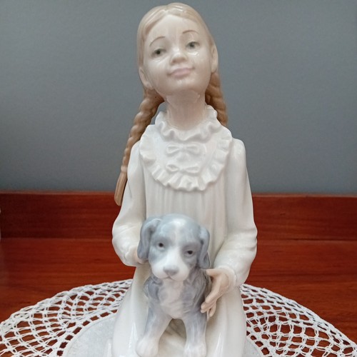 Nao lladro kneeling girl in - by,
