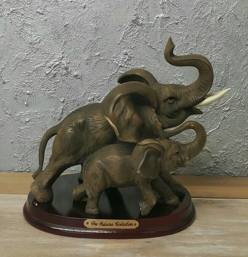 Elephant mother with baby - with,