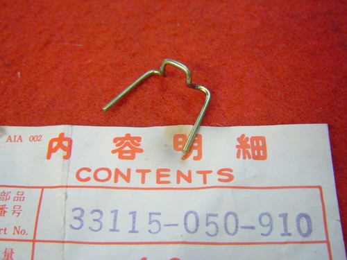 Headlight strapping clip for