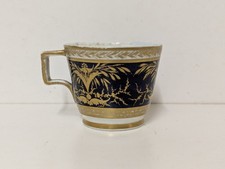 A Tiny Antique Hard Paste Porcelain Cup, Gilt Over Cobalt Blue, Gold Crown Mark