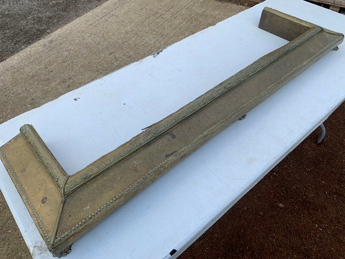 Decorative brass fire surround