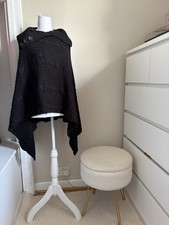 Black knitted cape with button on collar