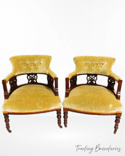 A pair of upholstered antique nursing chairs