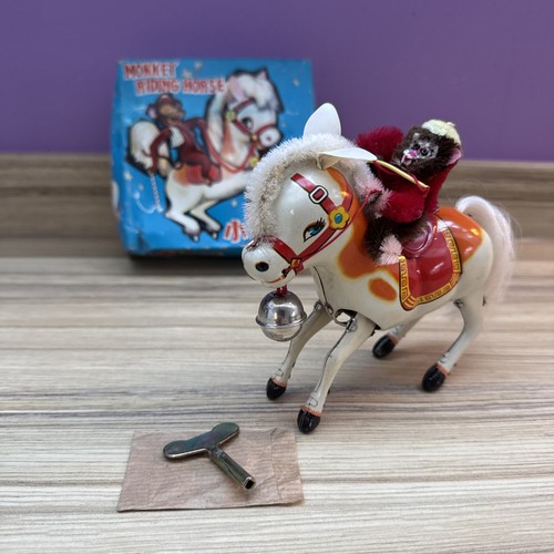 764 monkey riding horse tin - ms,