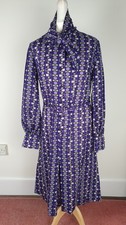 Vintage 1970s Jaeger wool dress with tie neck in geometric pattern Size 14