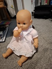 Thumb Sucking Doll In Cute Pink Dress.