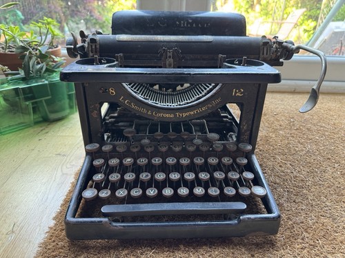 Antique smith and corona - and,