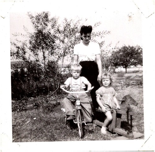 Stern mother with tricycle - with,