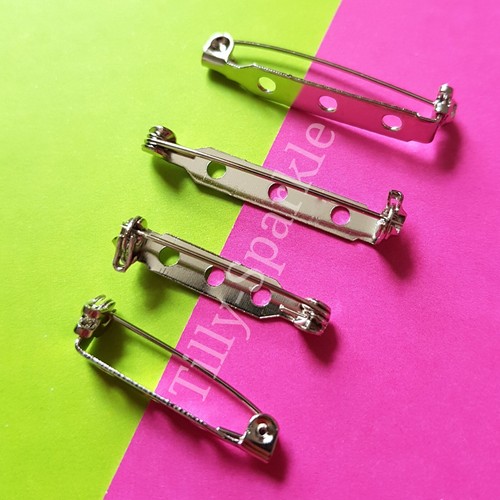 50 silver tone brooch - 20,