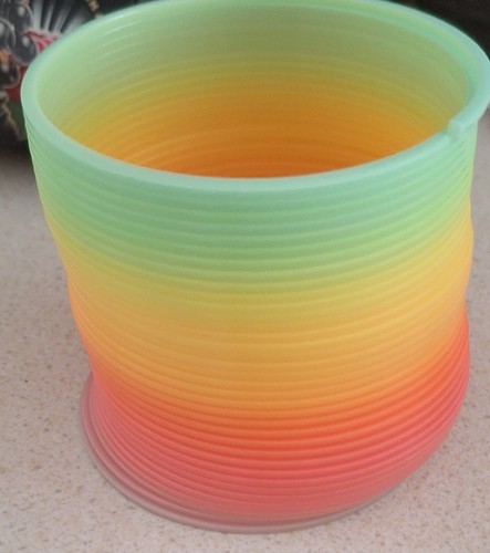 Rainbow plastic slinky spring - slinky,