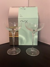 A pair of Nude Terroir Champagne saucers glasses