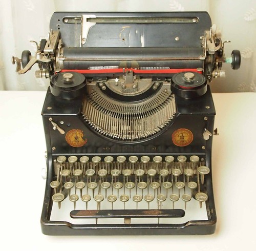 Antique triumph typewriter - triumph,