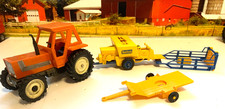 BRITAINS.1:32.FARM. FIAT DT880..4x4 TRACTOR,NEW HOLLAND  BALER.BALES, SLEDGE.