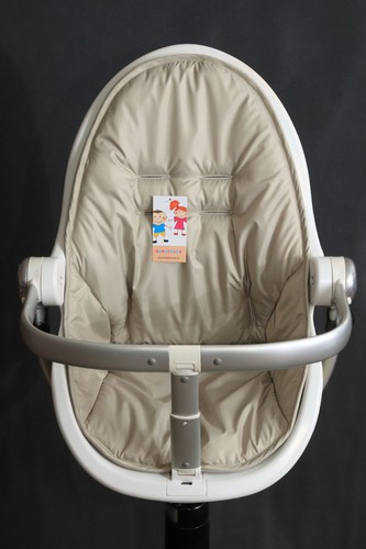 The brown cover for - , highchair