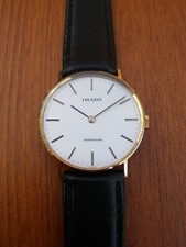 GENTS 9 CARAT GOLD IMADO  WATCH ON A STRAP MECHANICAL MOVEMENT BRAND NEW IN BOX