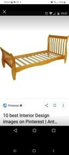 single wooden sleigh bed