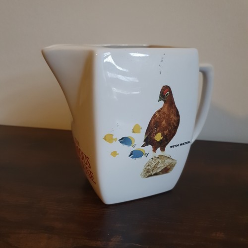 The famous grouse scotch - the,