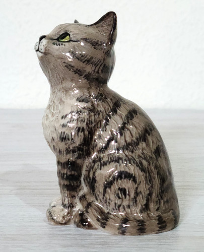Beswick seated looking - seated, up