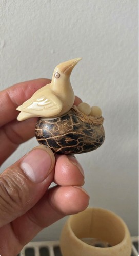 Hand carved bird nest - on, with