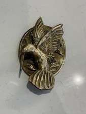 Brass hummingbird door knocker