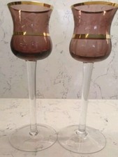 CANDLE HOLDERS Pair of tall long stem purple/cranberry etched & gilded glass