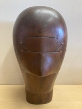 A HEAVY DARK WOOD BRASS