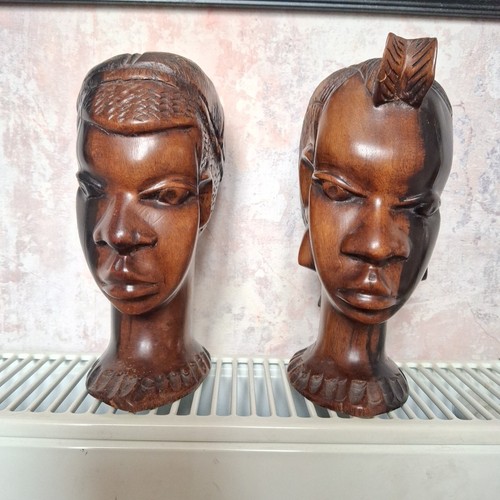 Pair carved tribal heads - of, /
