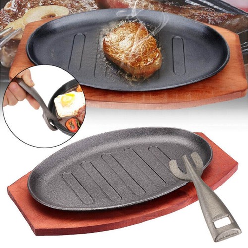 Large cast iron steak sizzling - iron,