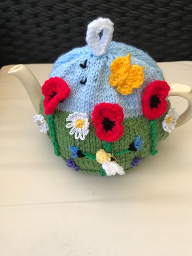 Hand knitted wildflower tea - hand,