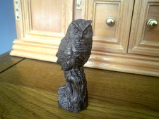 Carved wood Owl upon a log
