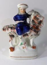 Genuine 19th century Staffordshire figure group with girl on goat 15.5cm high