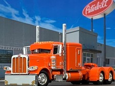 1/64 DCP ORANGE PETERBILT 389 W/ 63" FLAT TOP SLEEPER