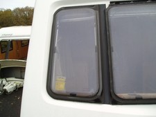 CARAVAN FRONT OFFSIDE WINDOW