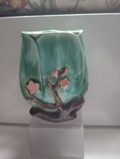 A Turquoise Vase With Pink