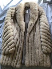 white saga fox fur coat