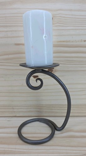 Wrought iron candle - holder, for