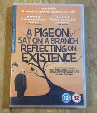 A Pigeon Sat On A Branch