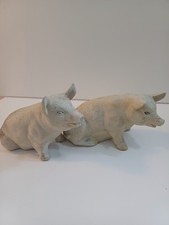 pair of vintage porcelain pig figurines