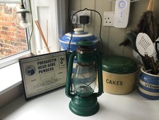 vintage green hurricane lamp