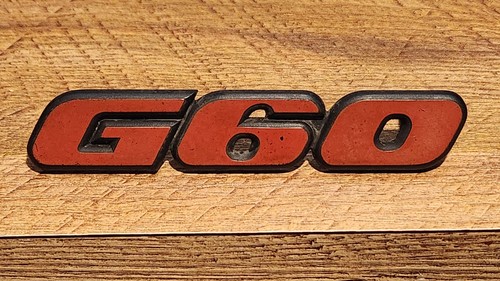Front grill badge genuine - front,