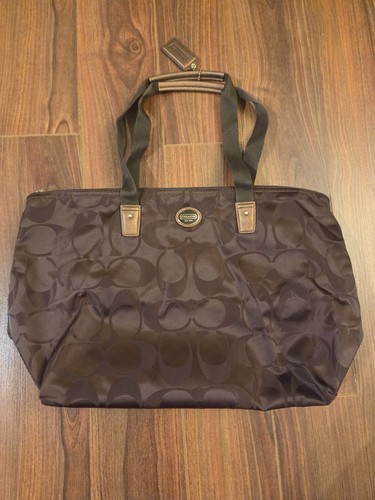 New coach getaway signature - new,